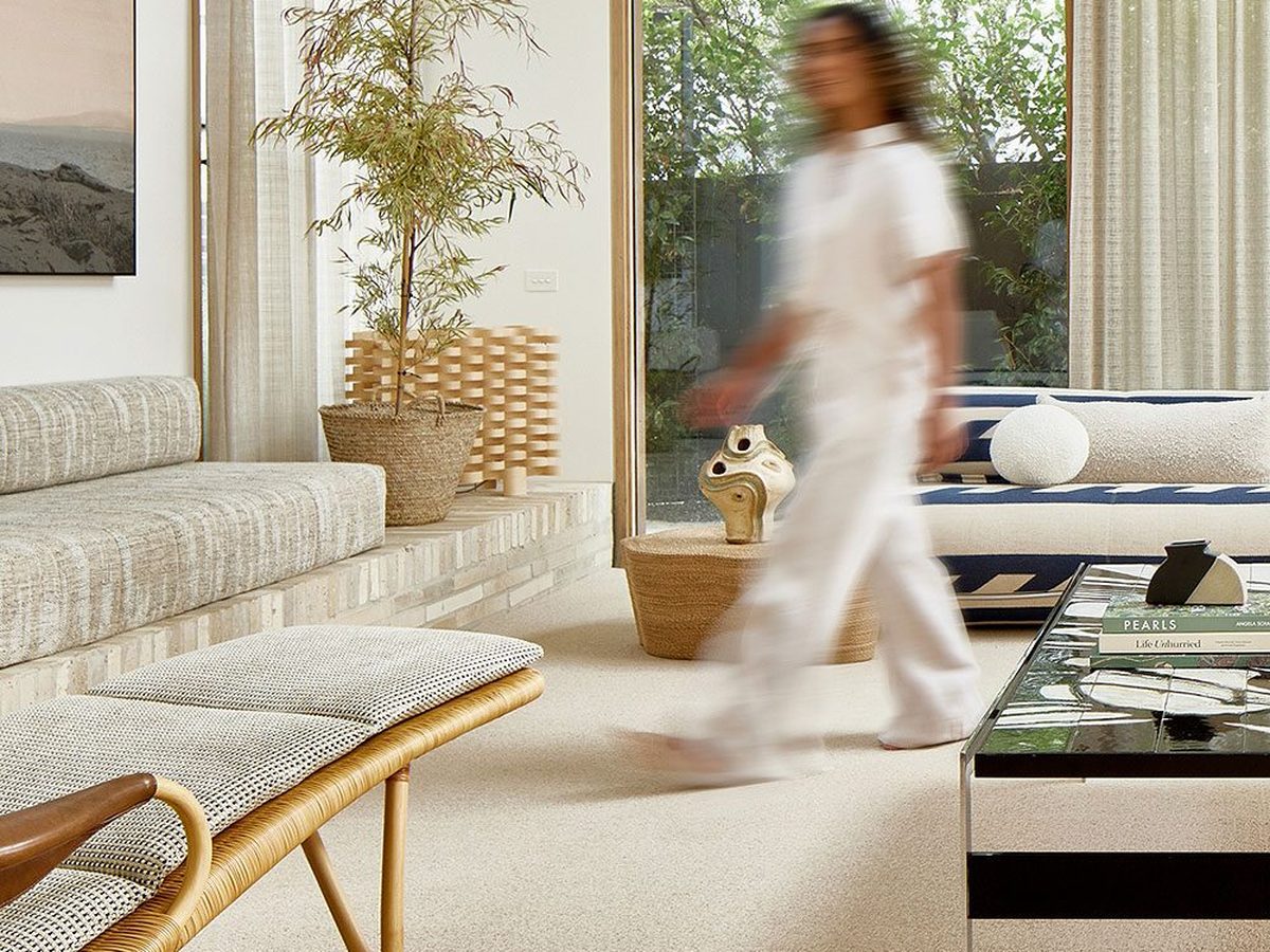 A bright living room with light carpet